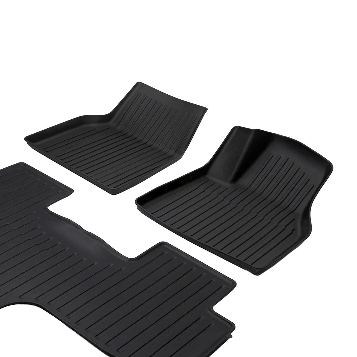 Set of four black rubber car floor mats with ribbed tread patterns for front and rear seating areas.