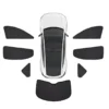 Top-down view of a white car with all window shade panels laid out around it around it.