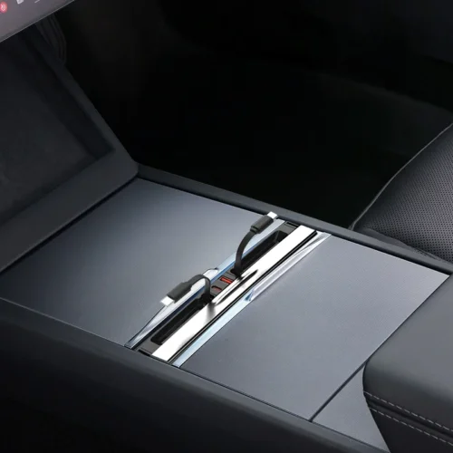 Car center console with a metal sliding charging dock and two USB-C cables connected
