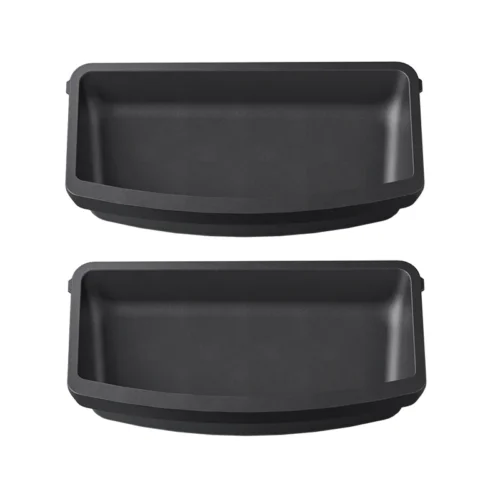 Two black rectangular baking pans, shallow with rounded corners, shown side by side.