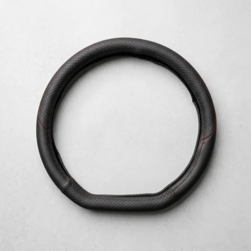 Black textured leather steering wheel cover with red stitching, displayed on a light gray background.