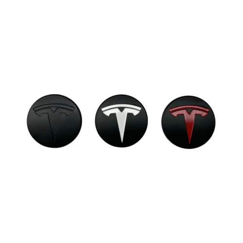 Three Tesla logo emblems on black circular bases, shown left to right in black, white, and red versions.