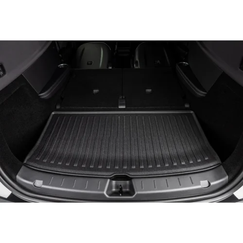 Flat-loading trunk area with rear seats folded, showing a ribbed cargo mat in a modern SUV/ hatchback
