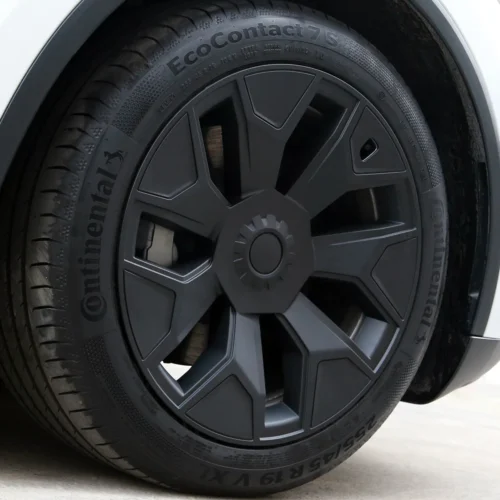 Close-up of a car wheel: dark gray alloy rim with a Continental EcoContact 7S tire mounted on it.